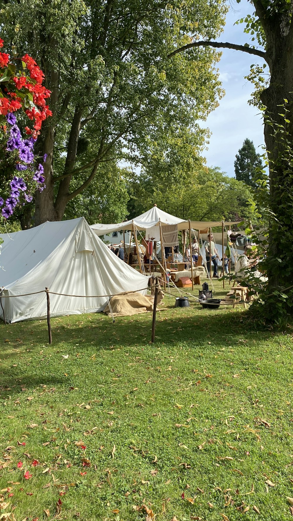 a tent set up in the middle of a field