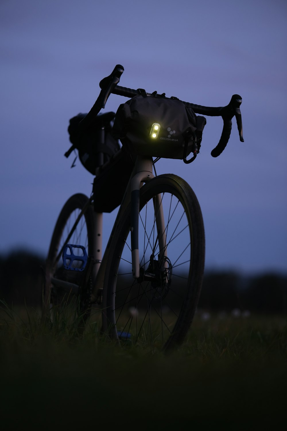 a close up of a bike with its lights on