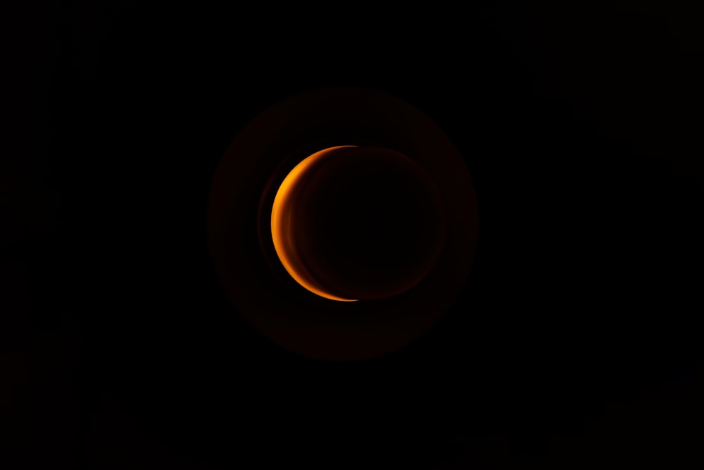 a eclipse in the sky with a black background