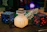 Pixel art style Minecraft-inspired icon of a glowing prayer jar with soft green glow.