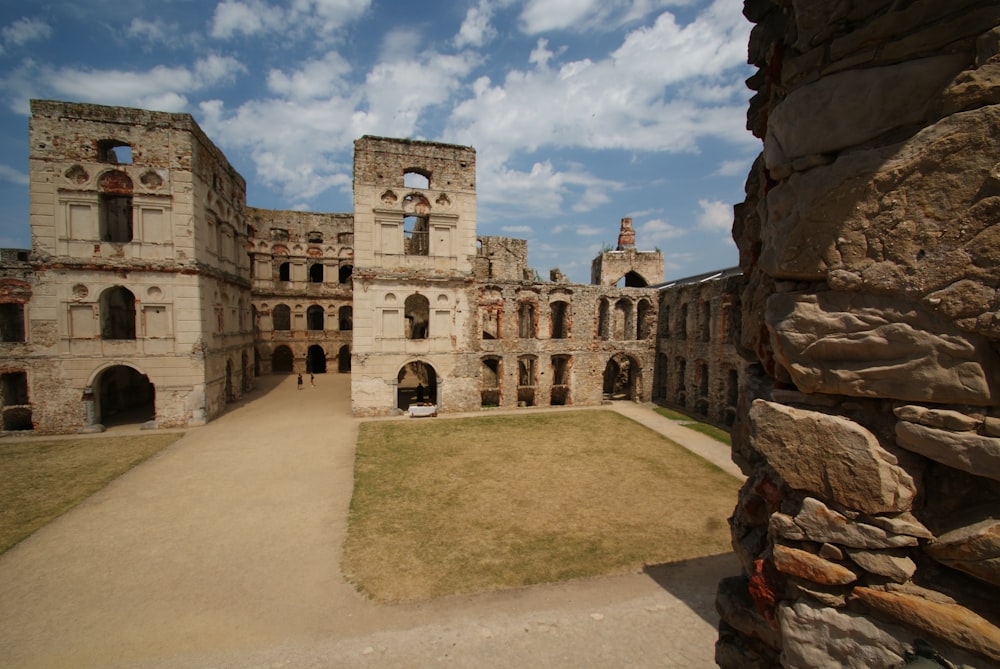 a stone building with a walkway leading to it