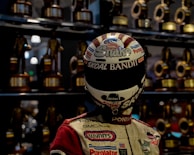 Jorge Solís holding his racing trophy with a big smile after a victory.