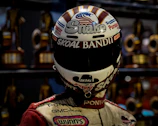 Close-up of a signed NASCAR helmet displayed in a custom shadowbox frame.