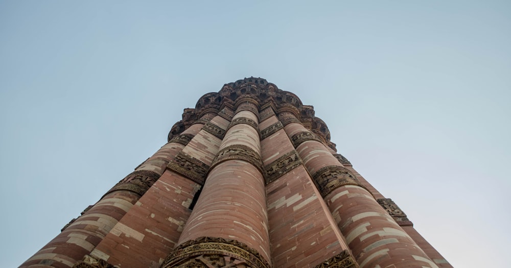 a tall tower with a clock on the top of it