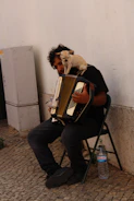 Duo Paf Touch The Dog performing lively outdoors with accordion and guitar