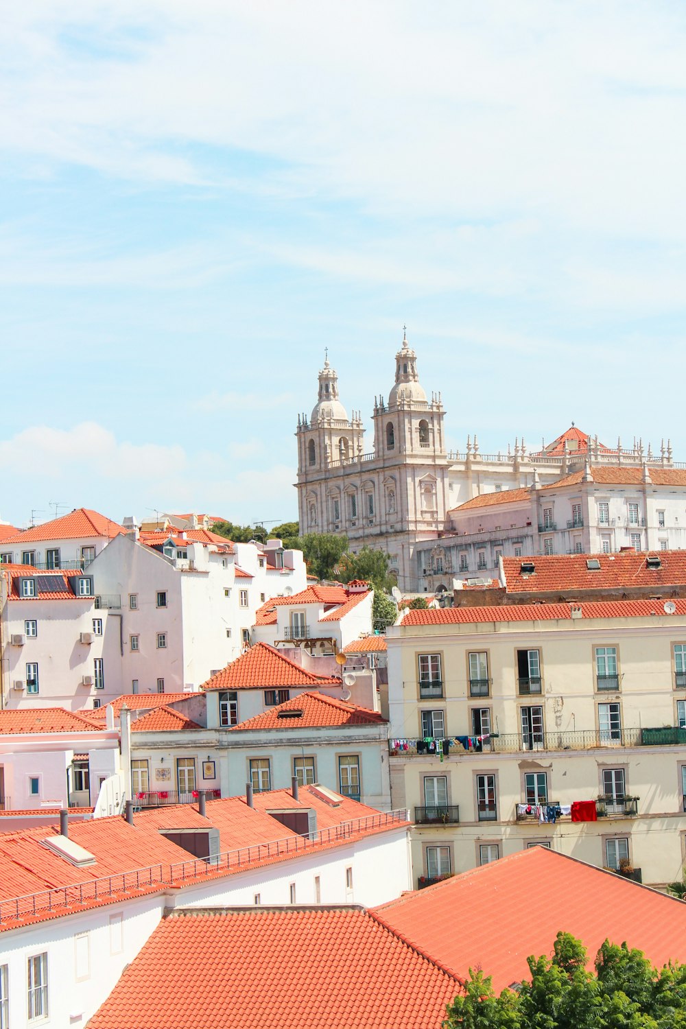 a view of a city with a church in the background