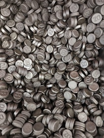 A pile of bright, metallic 99.99% pure zinc ingots ready for shipment.