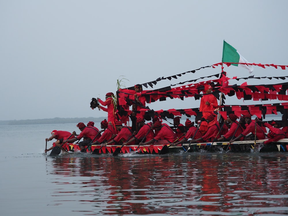 a group of people on a boat in the water