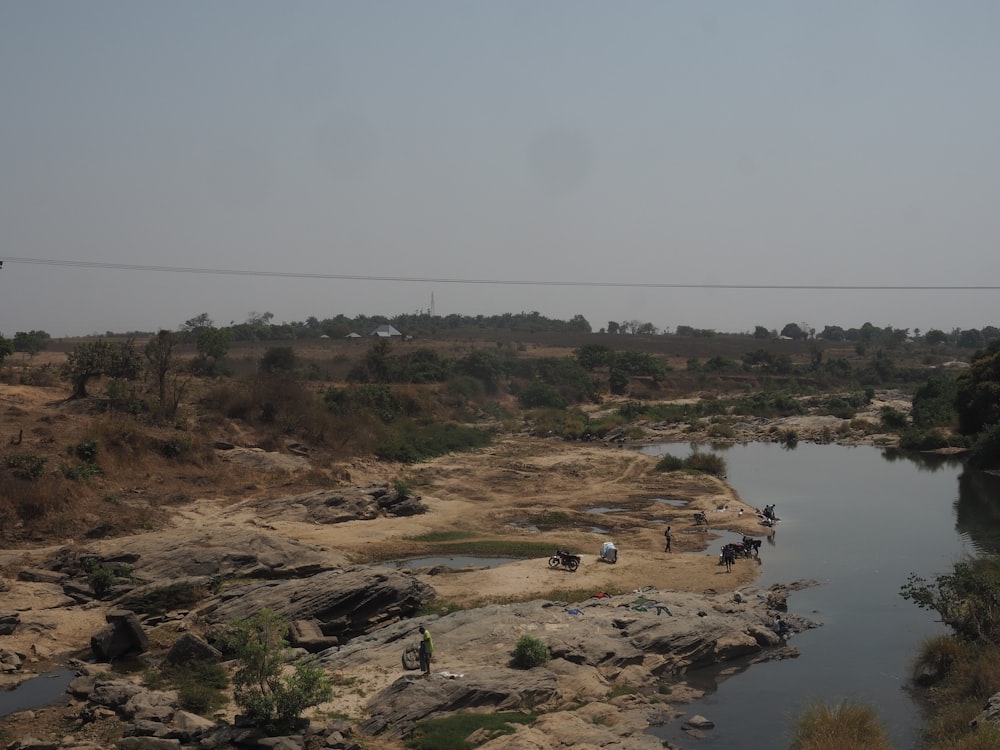 a body of water surrounded by land and trees