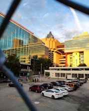 A panoramic view of a sleek, modern commercial office park in Hyderabad’s Kokapet area at sunset.