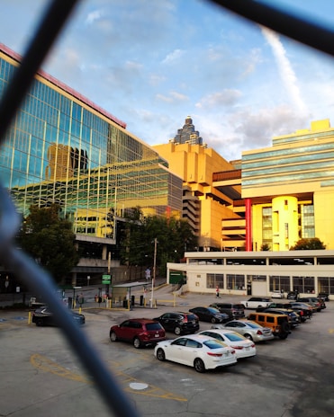 A panoramic view of a sleek, modern commercial office park in Hyderabad’s Kokapet area at sunset.