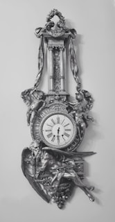 Classic floor clock with a polished finish and ornate details.