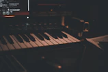A cozy studio corner featuring a vintage keyboard and headphones.