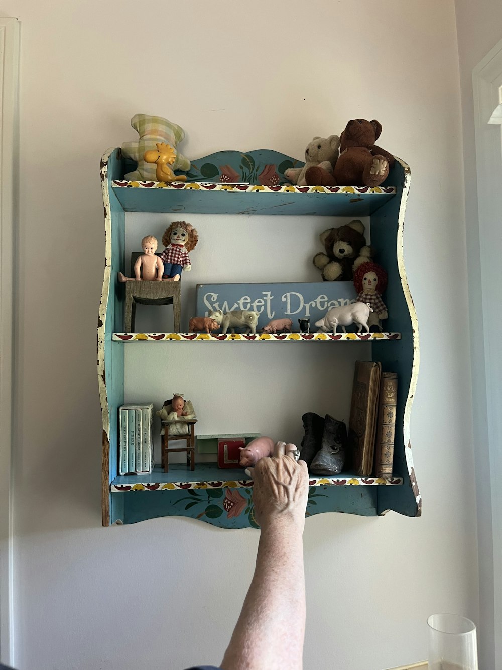a person sitting in front of a book shelf