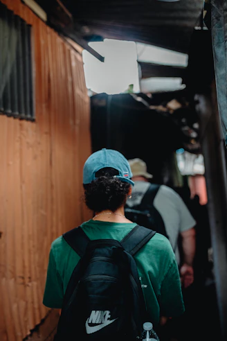 a man with a blue hat and a green shirt