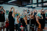a group of people standing around each other