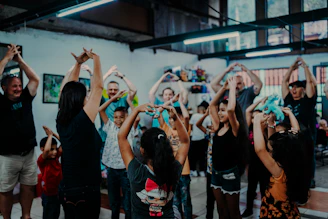 a group of people standing around each other