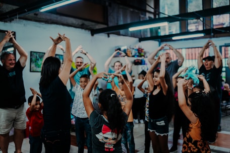 a group of people standing around each other