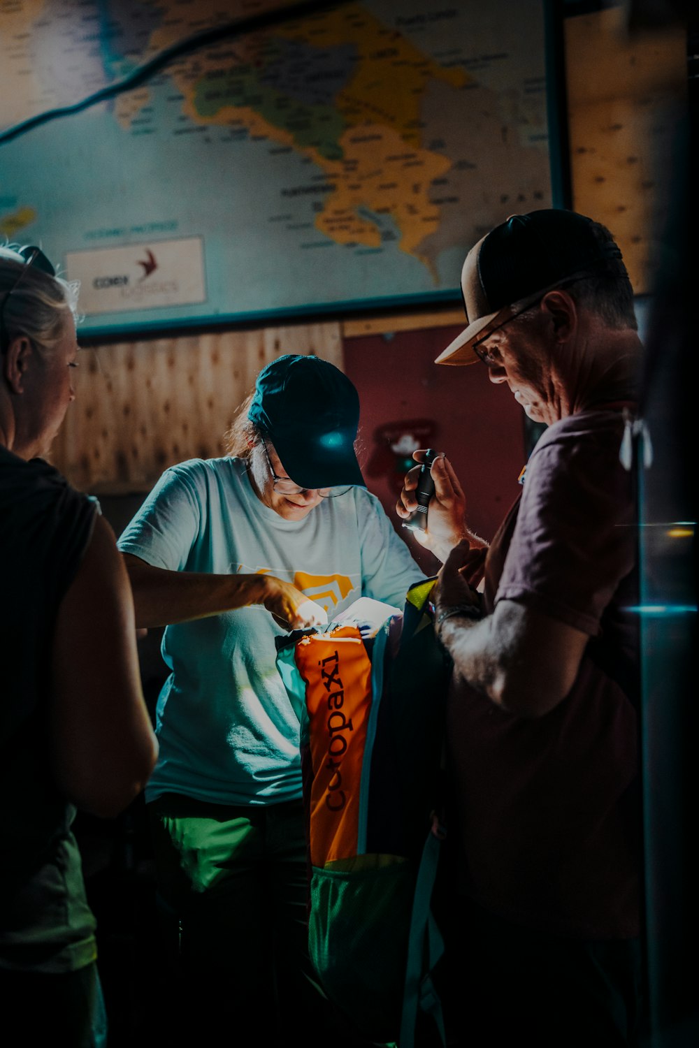 a group of people standing around each other