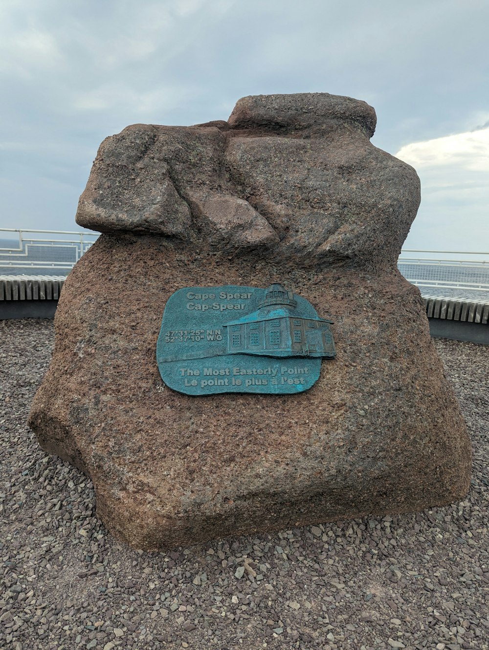 a large rock with a plaque on top of it