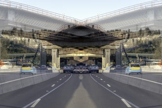 A panoramic view of a highway project in progress with multiple crews working.