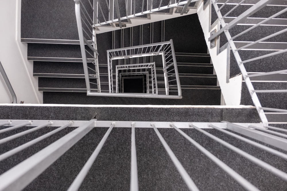 a spiral staircase in a building with a black and white photo