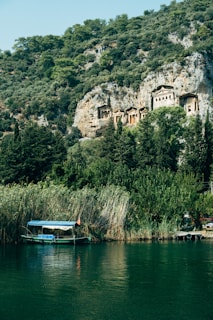 Panoramic view of the Asasif necropolis with the Nile River visible in the distance.