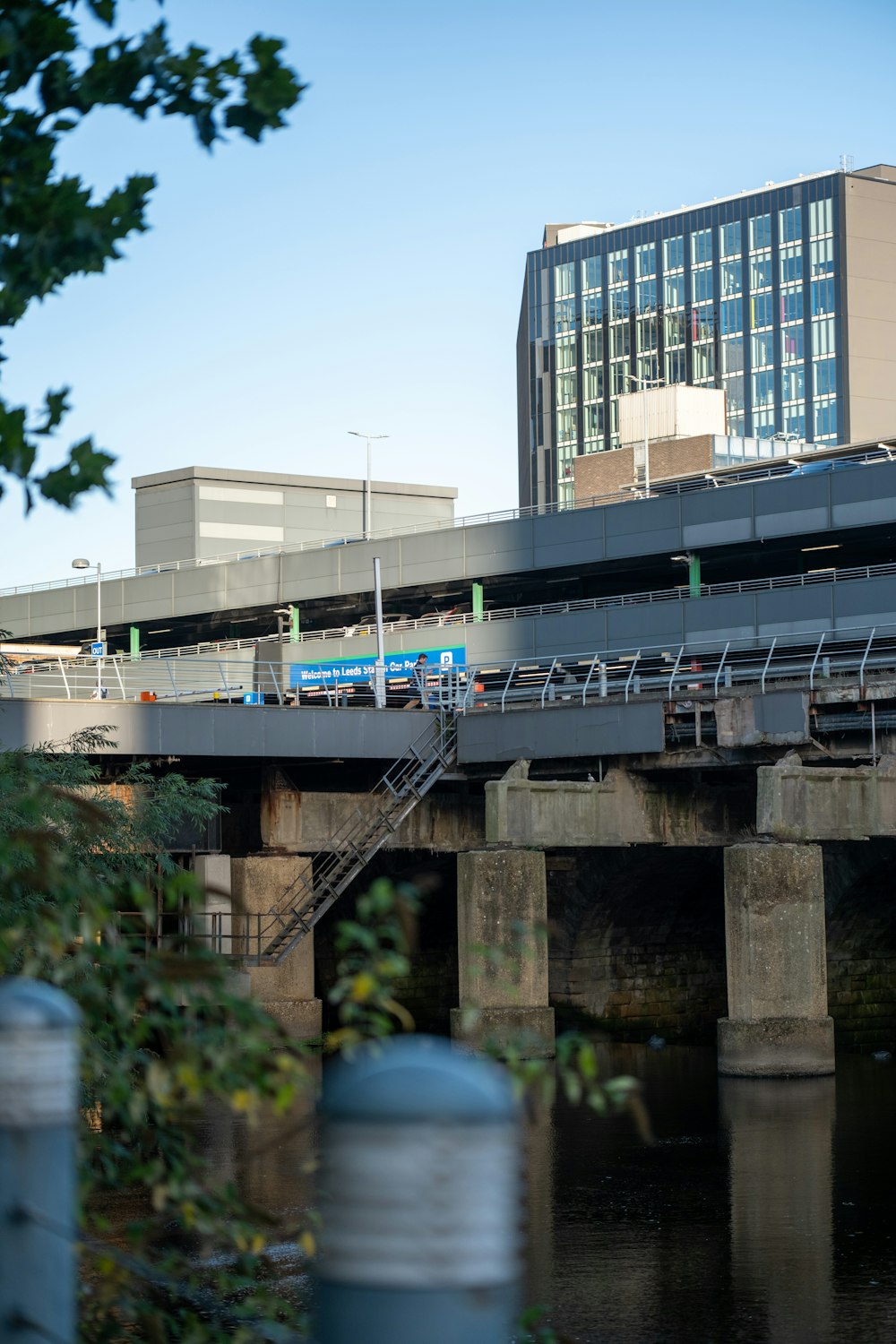 a train traveling over a bridge over a river