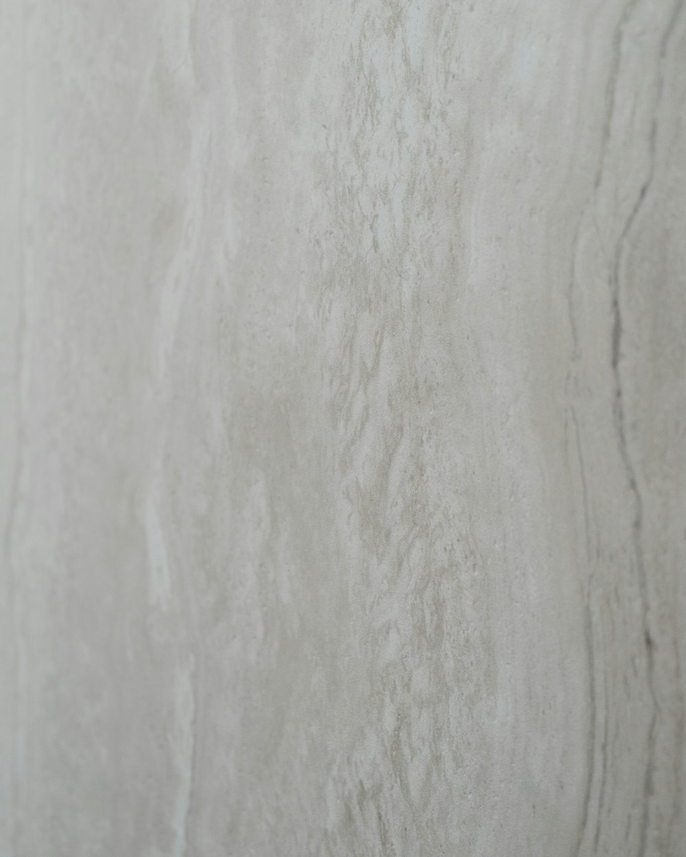 a close up of a white marble wall