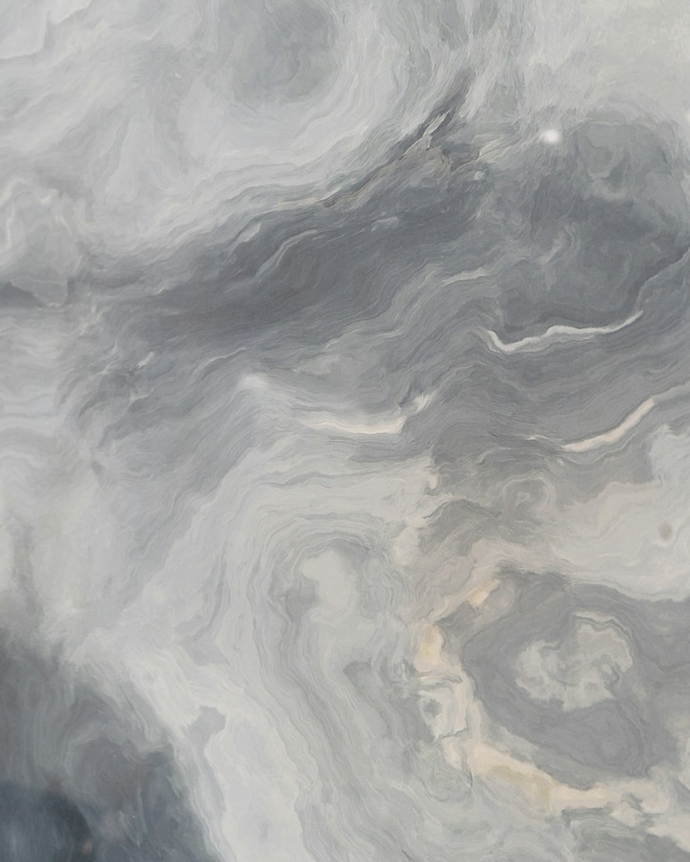 an abstract painting of grey and white colors