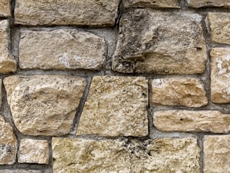 a close up of a stone wall made of rocks