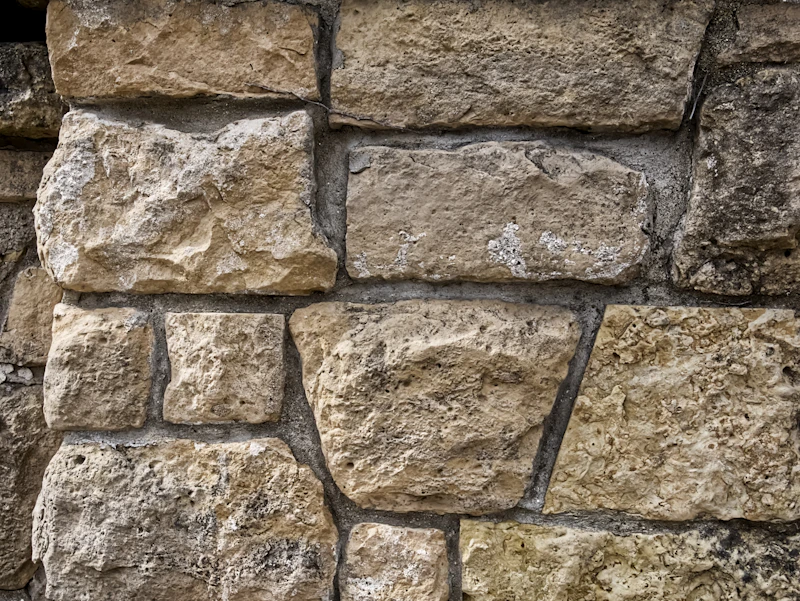 Cut sandstone block wall with tight mortar joints