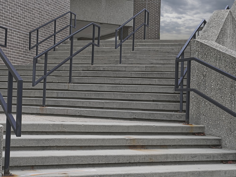 a man riding a skateboard down a set of stairs