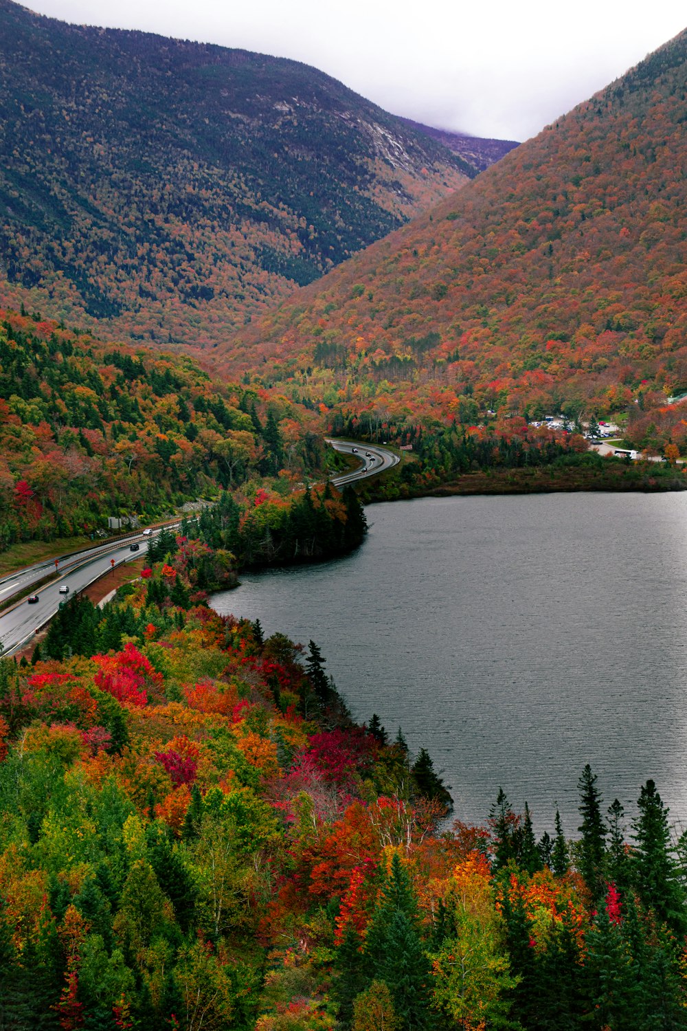 a scenic view of a lake surrounded by mountains