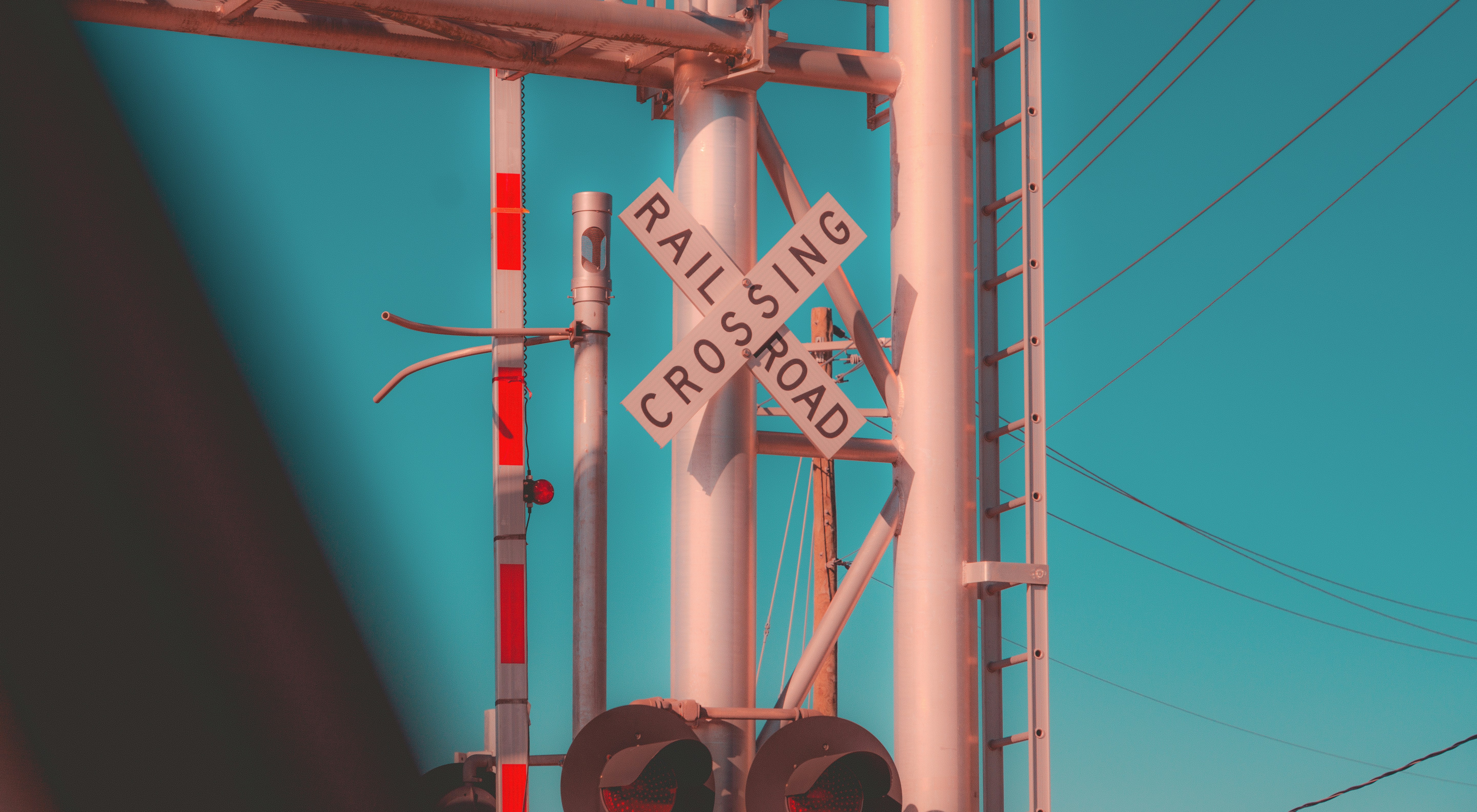 a railroad crossing with a railroad crossing sign