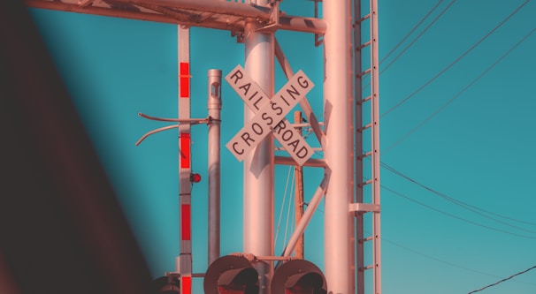 A well-maintained railway crossing with safety signs.