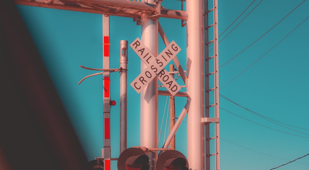 a railroad crossing with a railroad crossing sign