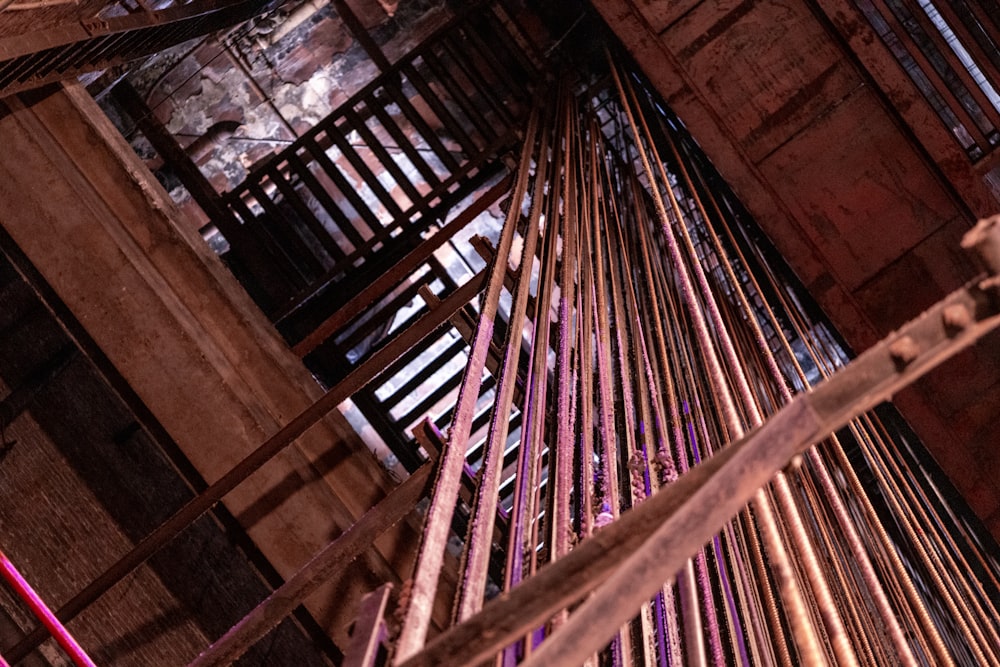 a stair case in a building with a clock on the top of it