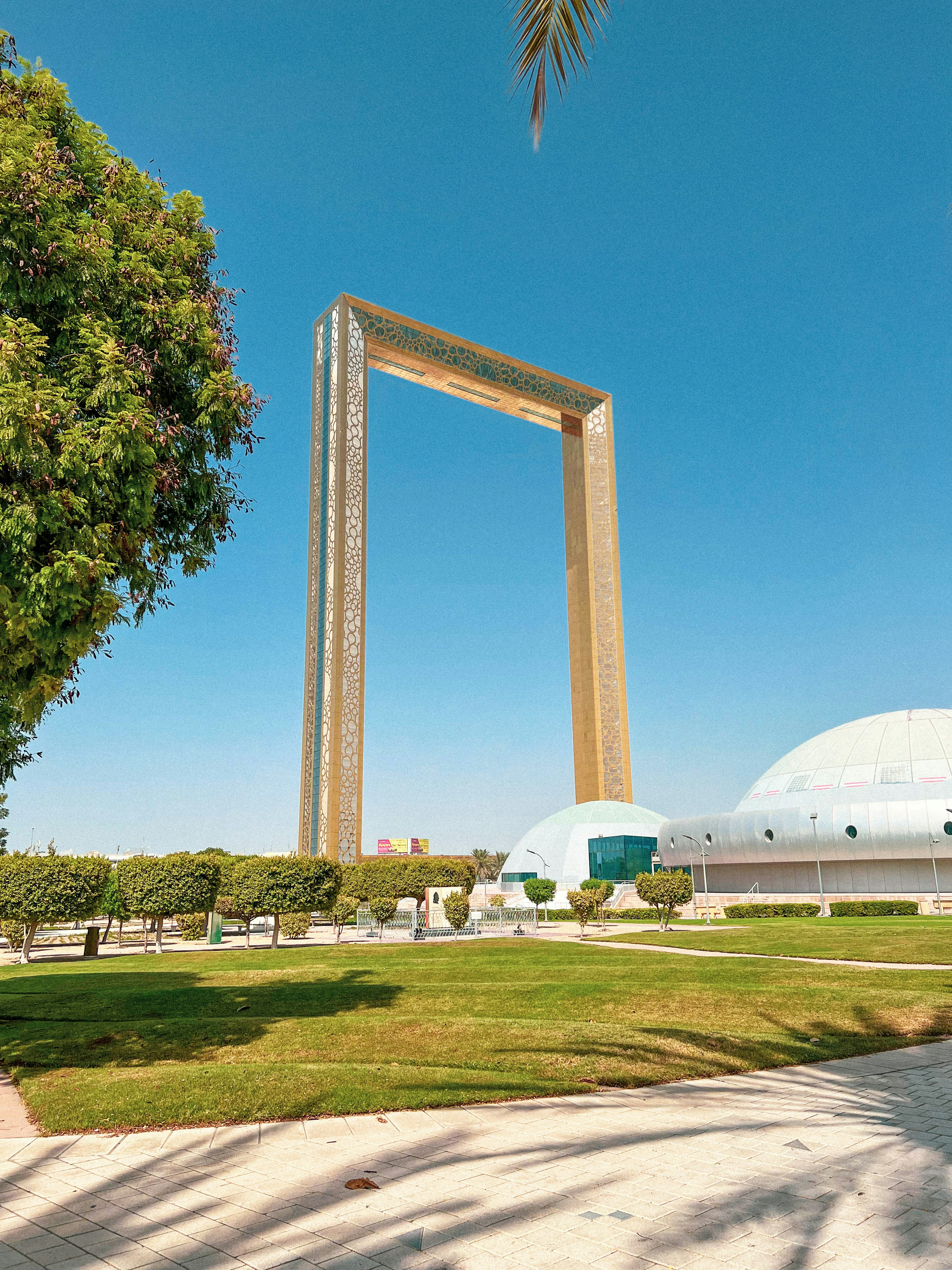 a large picture frame sitting in the middle of a park