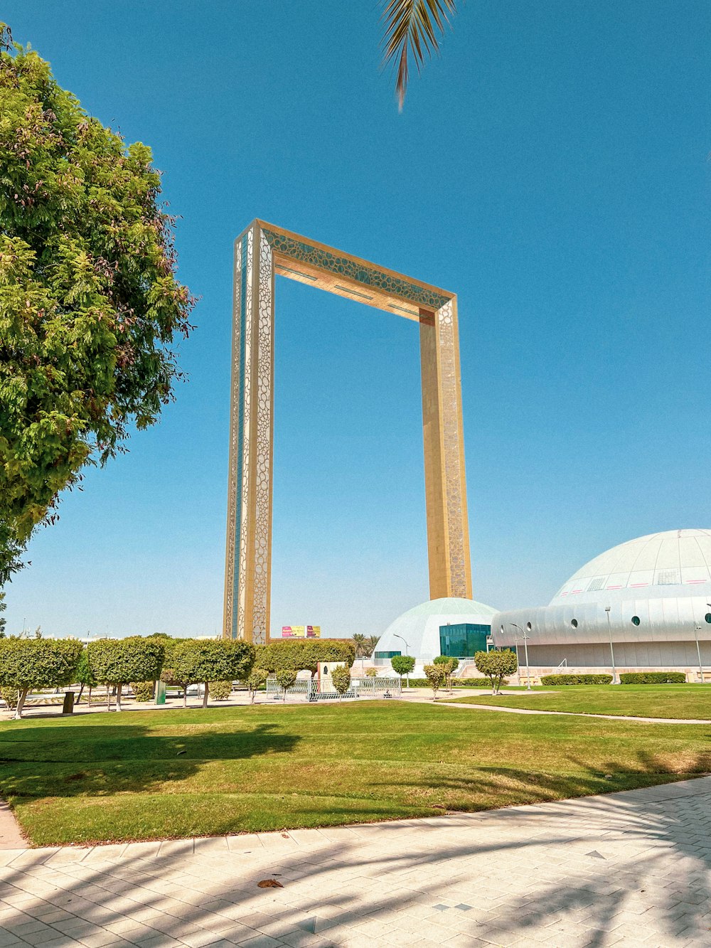 a large picture frame sitting in the middle of a park