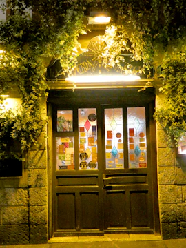 A welcoming doorway with a sign pointing to bloomnart.org.