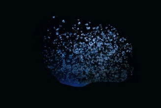 Dark space-like background with glowing blue Wi-Fi signal icons.