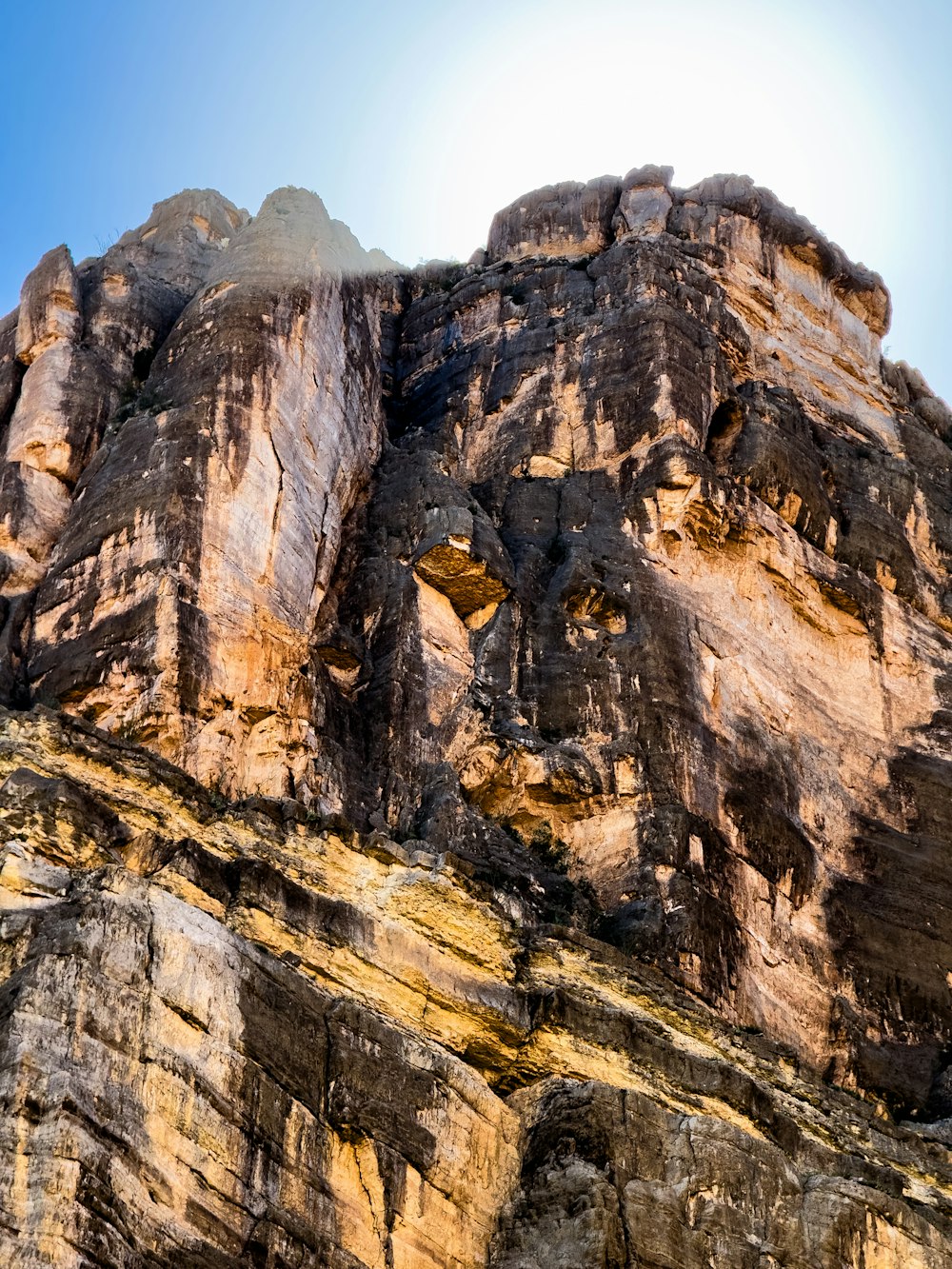 a very tall mountain with a sky background