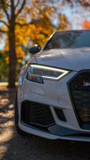 a close up of the front of a white car