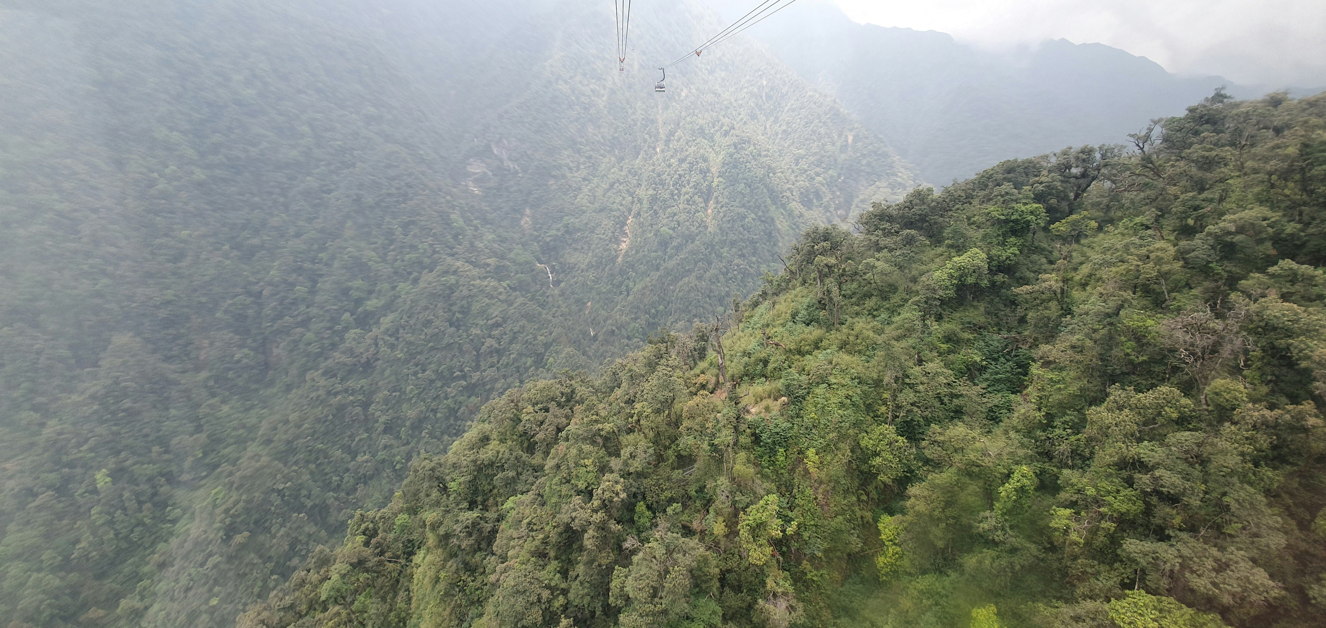 a view of a mountain with a cable going over it