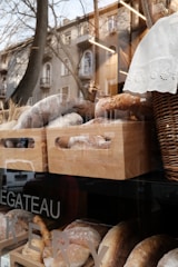 A small local bakery storefront with fresh bread displayed.