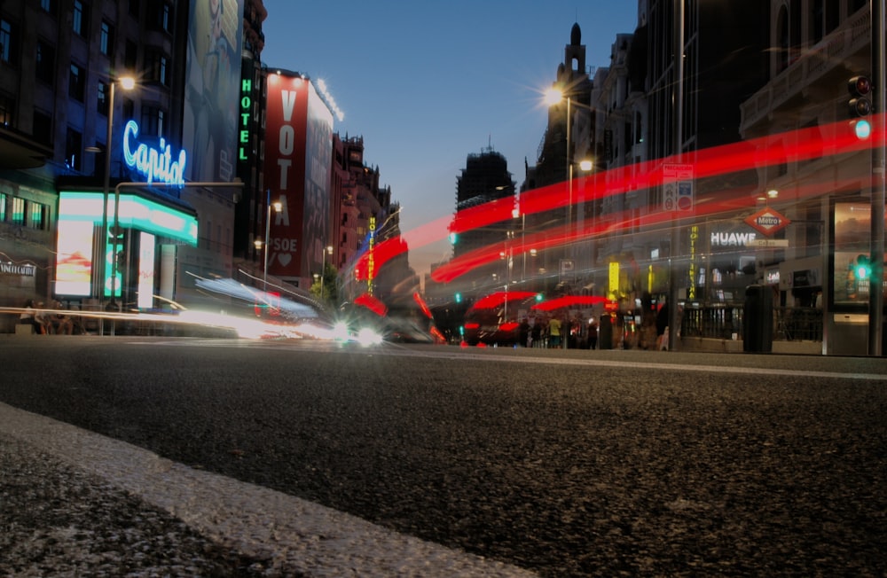 a city street filled with traffic at night