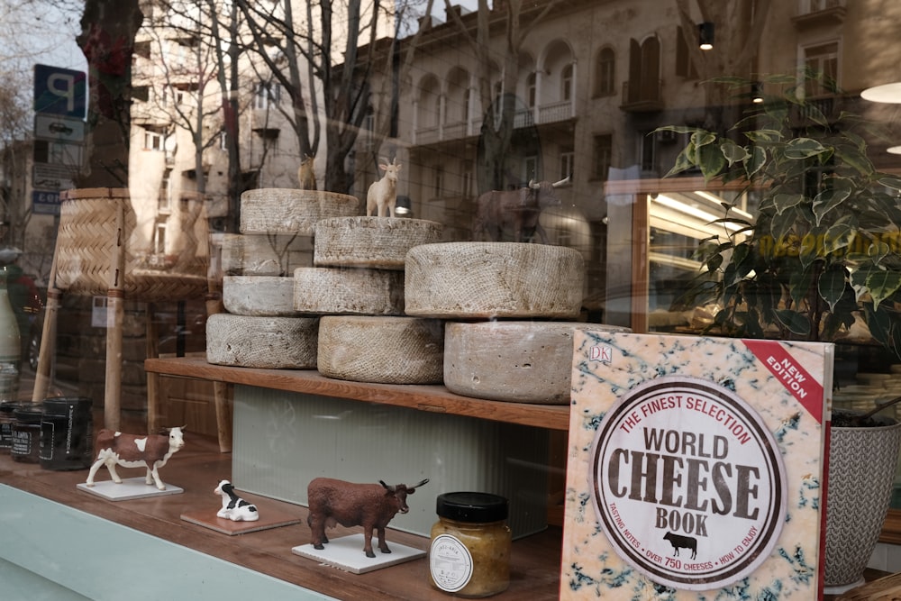 a display of cheese in a store window