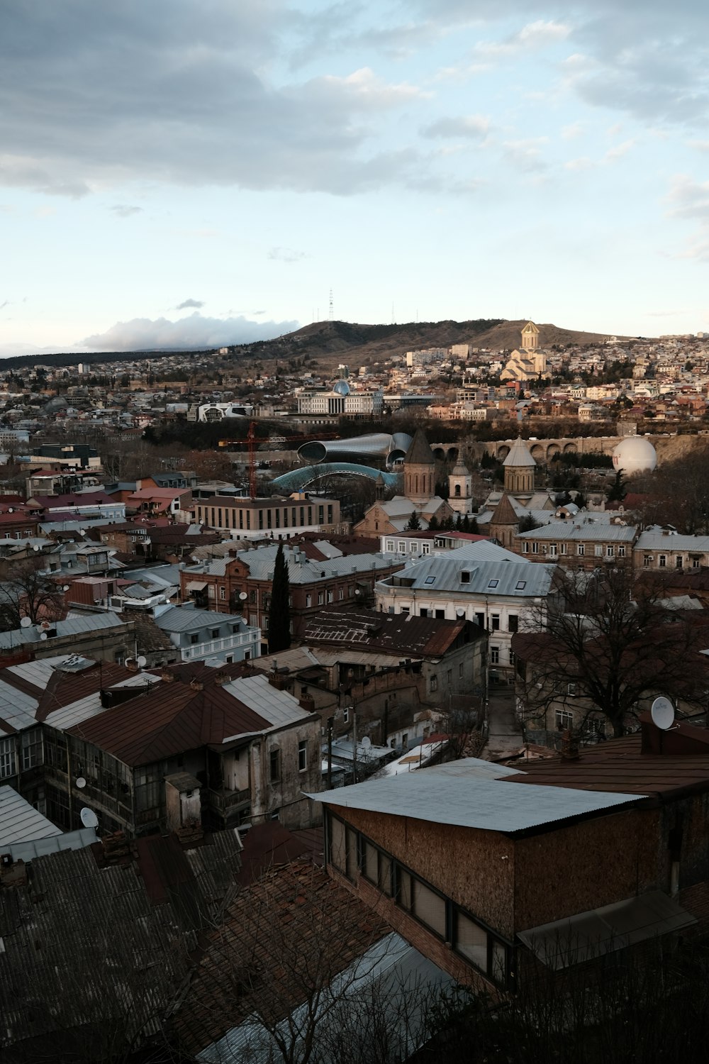 a view of a city from a hill