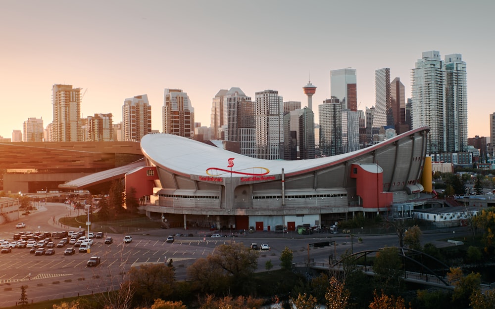 an aerial view of a stadium with a city in the background